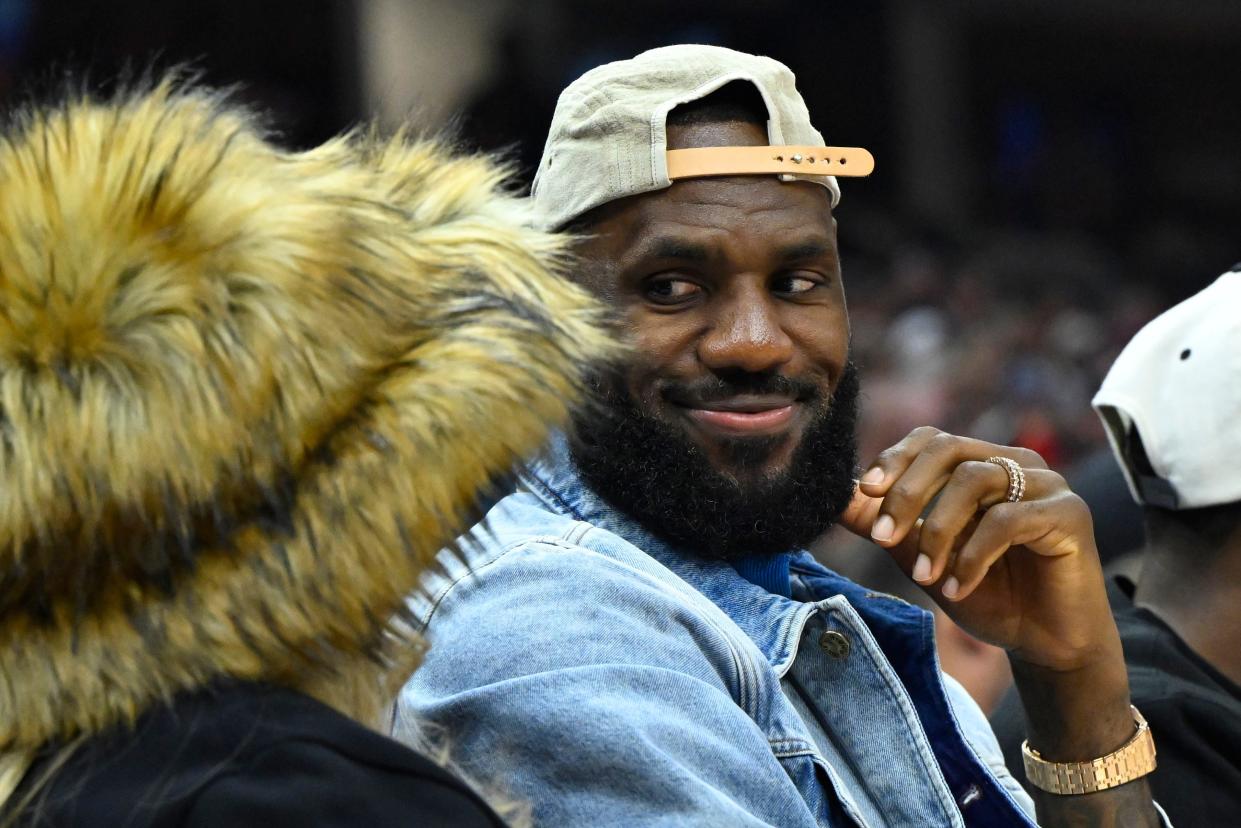 Lakers forward LeBron James looks at his wife, Savannah, watch the Cavaliers and Celtics in the second quarter of Game 4 of the Eastern Conference semifinals, May 13 in Cleveland.