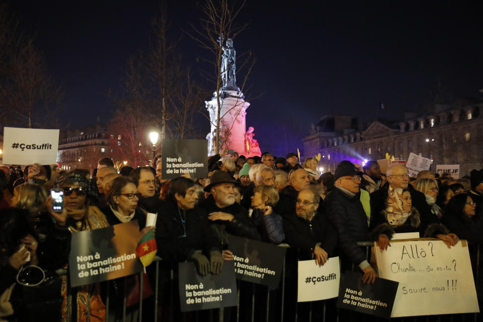 People gather at the Republique square to protest against anti-Semitism, in Paris, France, Tuesday, Feb. 19, 2019. In Paris and dozens of other French cities, ordinary citizens and officials across the political spectrum geared up Tuesday to march and rally against anti-Semitism, following a series of anti-Semitic acts that shocked the nation. (AP Photo/Christophe Ena)