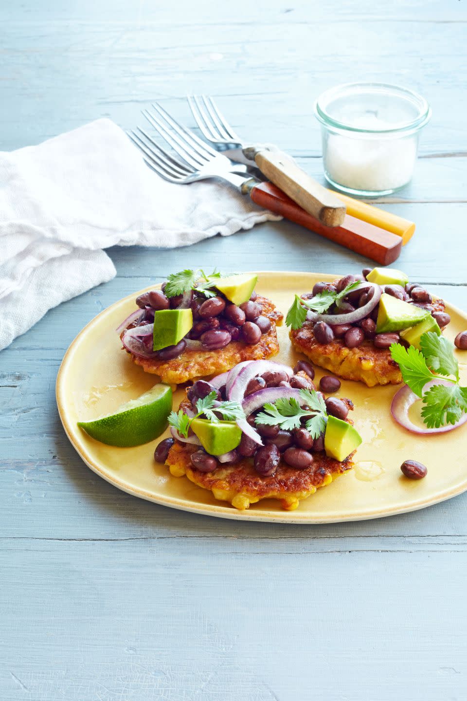<p>These fritters benefit from using fresh corn — frozen corn will cause the oil in the pan to splatter.</p><p><strong><a href="https://www.countryliving.com/food-drinks/recipes/a34554/corn-fritters-black-bean-salad-recipe-ghk0914/" rel="nofollow noopener" target="_blank" data-ylk="slk:Get the recipe;elm:context_link;itc:0" class="link ">Get the recipe</a>.</strong></p>