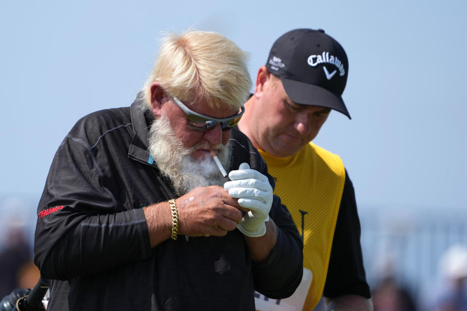 July 20, 2023; Hoylake, England, GBR; John Daly lights a cigarette during the first round of The Open Championship golf tournament at Royal Liverpool. Mandatory Credit: Kyle Terada-USA TODAY Sports