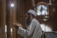 A Kashmiri Muslim prays ahead of Eid prayers inside a mosque in Srinagar, Indian controlled Kashmir, Thursday, May 13, 2021. (AP Photo/ Dar Yasin)