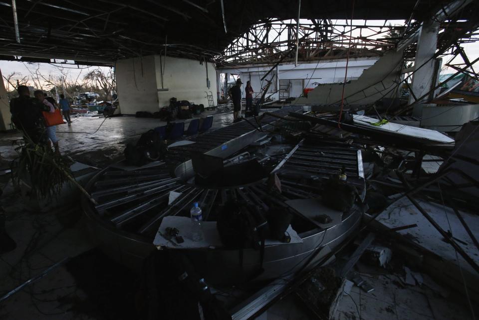 A view inside a damaged airport after super Typhoon Haiyan battered Tacloban city in central Philippines November 9, 2013. Possibly the strongest typhoon ever to hit land devastated the central Philippine city of Tacloban, killing at least 100 people, turning houses into rubble and leveling the airport in a surge of flood water and high wind, officials said on Saturday. The toll of death and damage from Typhoon Haiyan on Friday is expected to rise sharply as rescue workers and soldiers reach areas cut off by the massive, fast-moving storm which weakened to a category 4 on Saturday. REUTERS/Erik De Castro (PHILIPPINES - Tags: DISASTER ENVIRONMENT TRANSPORT)