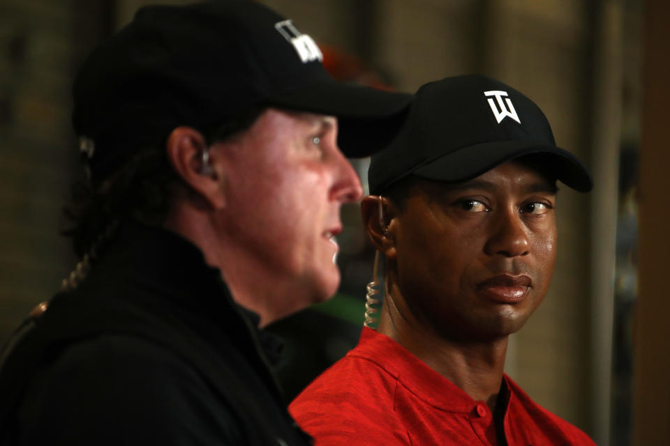 LAS VEGAS, NV - NOVEMBER 20:  (EXCLUSIVE COVERAGE) Tiger Woods looks over at Phil Mickelson as they do a spot for TV before The Match at Shadow Creek Golf Course on November 20, 2018 in Las Vegas, Nevada.  (Photo by Christian Petersen/Getty Images for The Match)