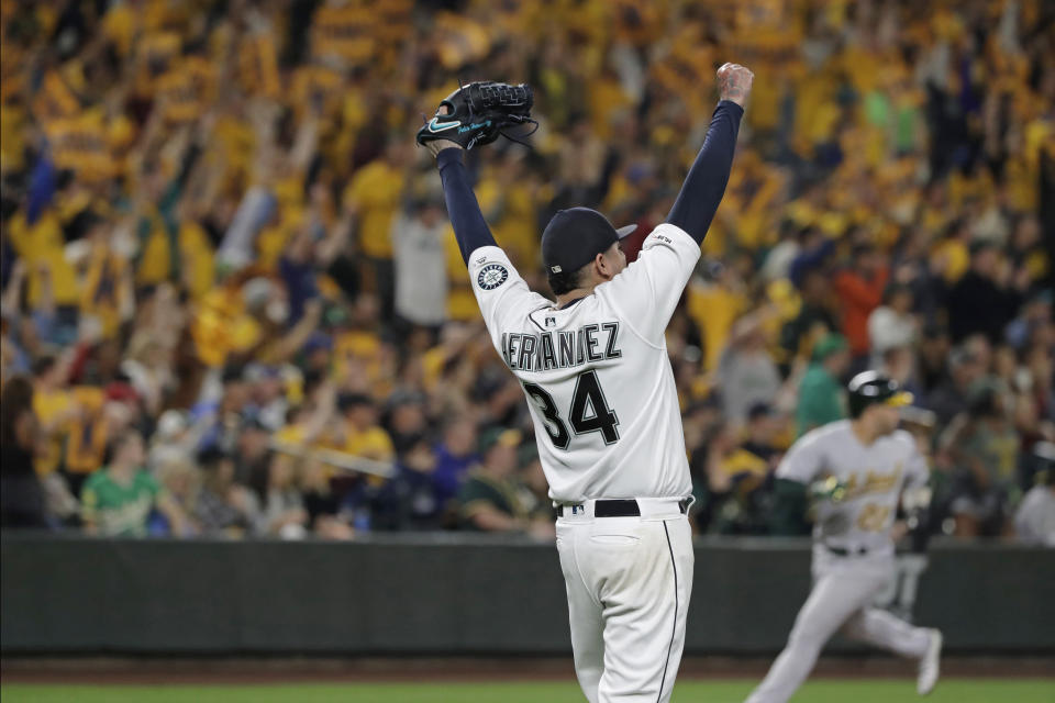 Seattle Mariners starting pitcher Felix Hernandez celebrates getting out of a bases-loaded jam to end the top of the fifth inning of the team's baseball game against the Oakland Athletics, Thursday, Sept. 26, 2019, in Seattle. (AP Photo/Ted S. Warren)