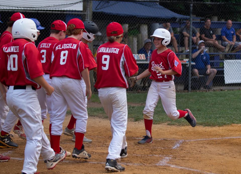 Point Beach's Fin Czaplinski is greeted at home plate after hitting a first inning home run to put his team up 1-0. Point Pleasant Beach defeats Milltown in the losers bracket of the Section 3 Tournament on Tuesday, July 20, 2021 in Hamilton.