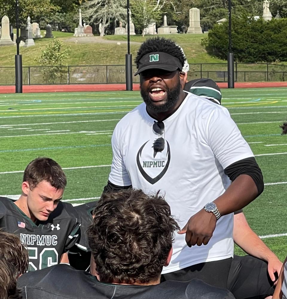 Nipmuc head coach James Royster addresses his team after the Warriors defeated Assabet on Saturday, Sept. 16, 2023 in Northbridge.