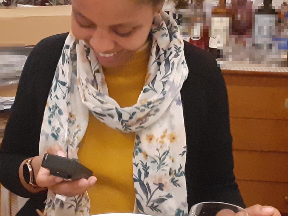 A picture of Insider reporter's friend holding a Geiger counter during a dinner party