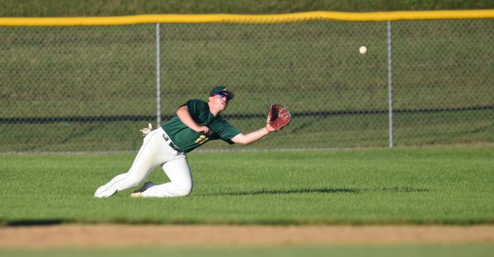 Avon's Jackson Henderson makes a diving catch in right field Wednesday, July 13, 2022, at Schneider Field in St. Joseph.