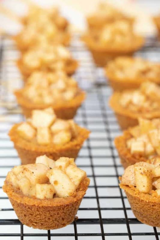 <p>Princess Pinky Girl</p><p>Caramel apple crisp bites bring all of the flavors of fall into one delicious dessert. The apple cinnamon filling and the graham cracker crust will warm your heart and fill your tummy. </p><p><strong>Get the recipe: <em><a href="https://princesspinkygirl.com/apple-crisp-bites/" rel="nofollow noopener" target="_blank" data-ylk="slk:Caramel Apple Crisp Bites;elm:context_link;itc:0;sec:content-canvas" class="link ">Caramel Apple Crisp Bites</a></em></strong></p>