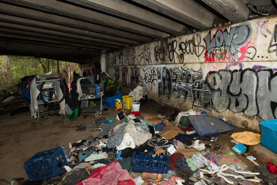 Homeless people live under a bridge in North Jackson on Friday, Nov. 17.