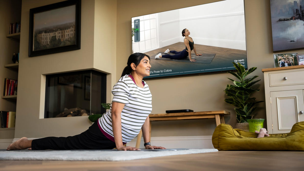  Mvmnt app (Sky Glass) – woman doing yoga. 