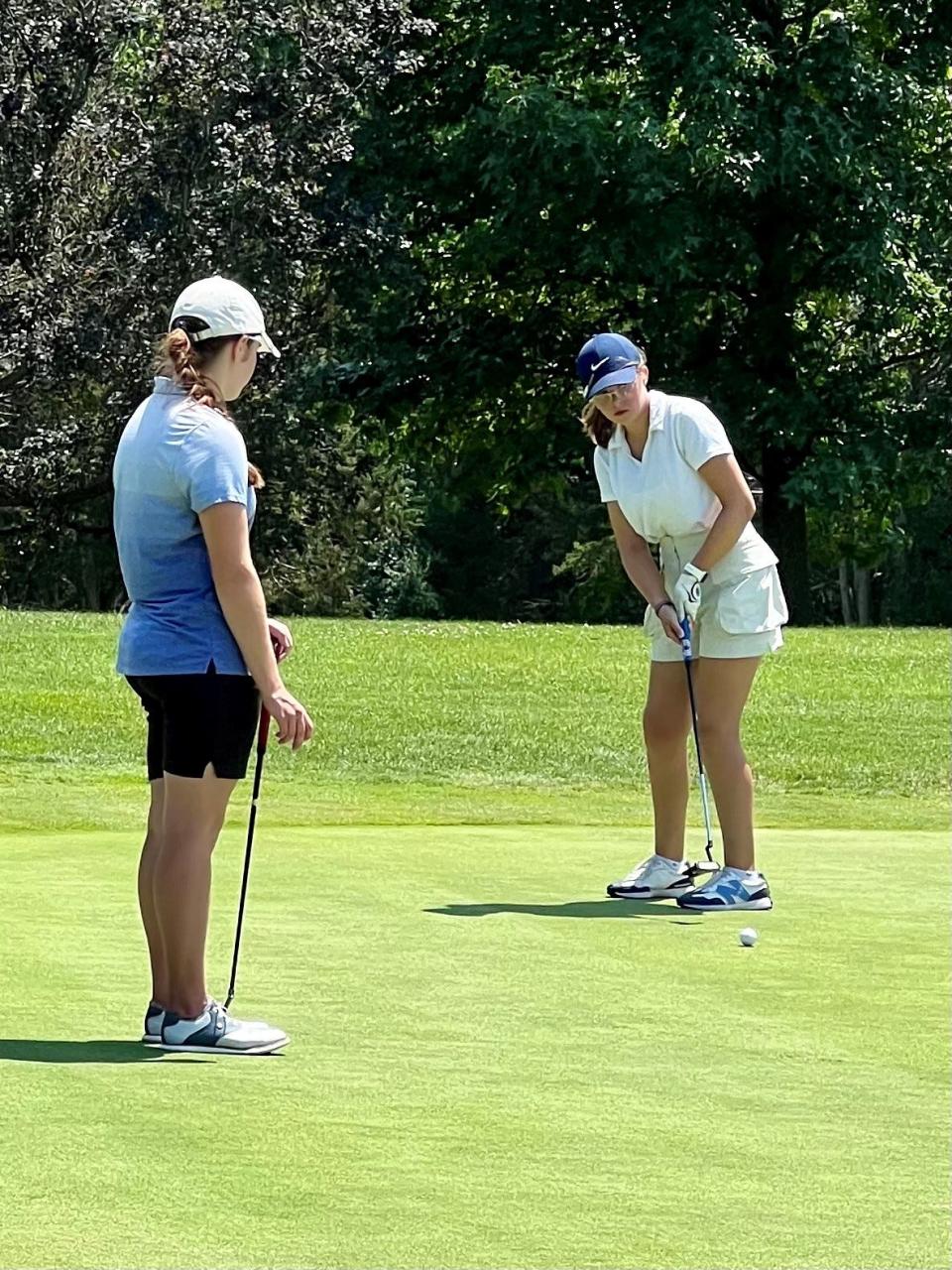 Maura Murphy watches as Olivia Ross putts during the final regular season tournament of the 2024 Heart of Ohio Junior Golf Association season was held Monday at Valley View Golf Course near Galion.