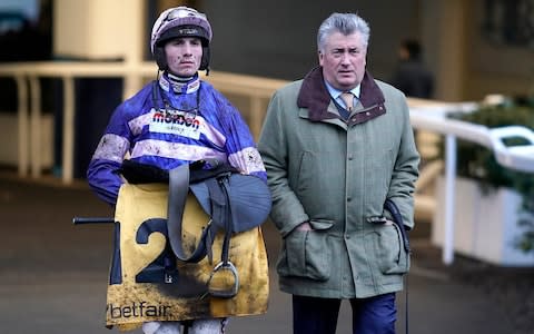 Paul Nicholls (right) has won 10 Ladbrokes King George VI Chases in the past 22 years - Credit: GETTY IMAGES