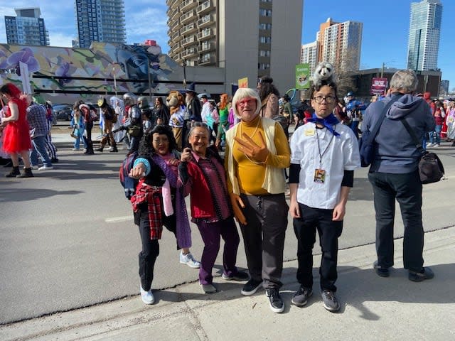 Serenity Than, middle left, and her family members Daisy Than, Jeremy Whalen and Logan Whalen, from left to right, cosplaying the 2022 sci-fi film, Everything Everywhere All at Once.