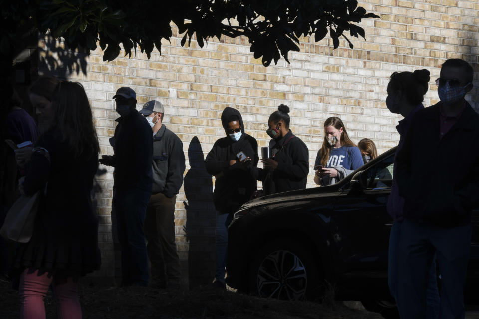 Voters wait in line to cast their ballots in the 2020 election Tuesday, Nov. 3, 2020, in Auburn, Ala. (AP Photo/Julie Bennett)