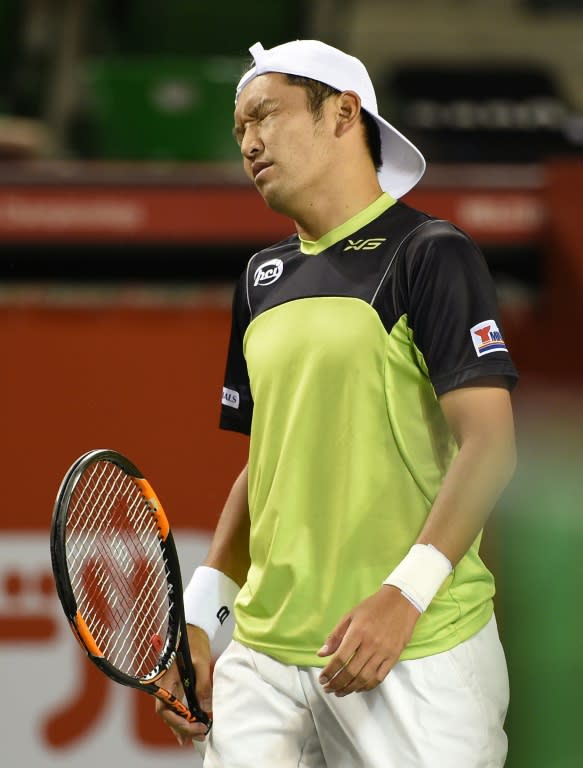 Japan's Tatsuma Ito reacts after losing a point against Stan Wawrinka of Switzerland during their second round match in the Japan Open in Tokyo, on October 7, 2015