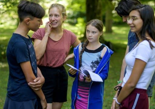 Youth climate activist Greta Thunberg (c) said she hoped governments would act on the IPCC's landmark report's findings