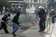 <p>A protester attacks with a hammer to a riot police officer during clashes at a nationwide general strike demonstration, in Athens Wednesday, May 17, 2017. Greek workers walked off the job across the country Wednesday for an anti-austerity general strike that was disrupting public and private sector services across the country. (AP Photo/Thanassis Stavrakis) </p>