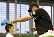 MIAMI, FL - APRIL 13: Pitcher Heath Bell of the Miami Marlins signs autographs before playing against the Houston Astros at Marlins Park on April 13, 2012 in Miami, Florida. (Photo by Marc Serota/Getty Images)