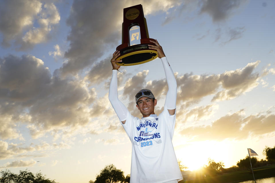 Florida golfer Ricky Castillo poses for photographers after winning the NCAA college men's match play golf championship against Georgia Tech, Wednesday, May 31, 2023, in Scottsdale, Ariz. (AP Photo/Matt York)