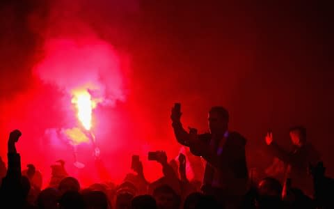 Liverpool fans light flares before the UEFA Champions League Semi Final First Leg match between Liverpool and AS Roma at Anfield  - Credit: Chris Brunskill Ltd/Getty Images