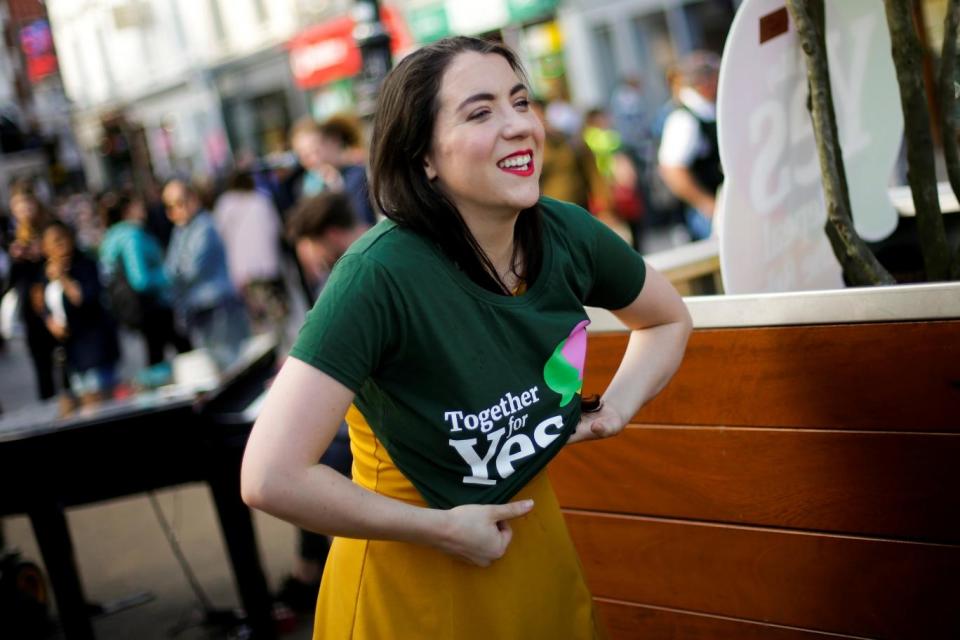 A Yes supporter dons a T-shirt ahead of the expected landslide win for legalising abortion (REUTERS)