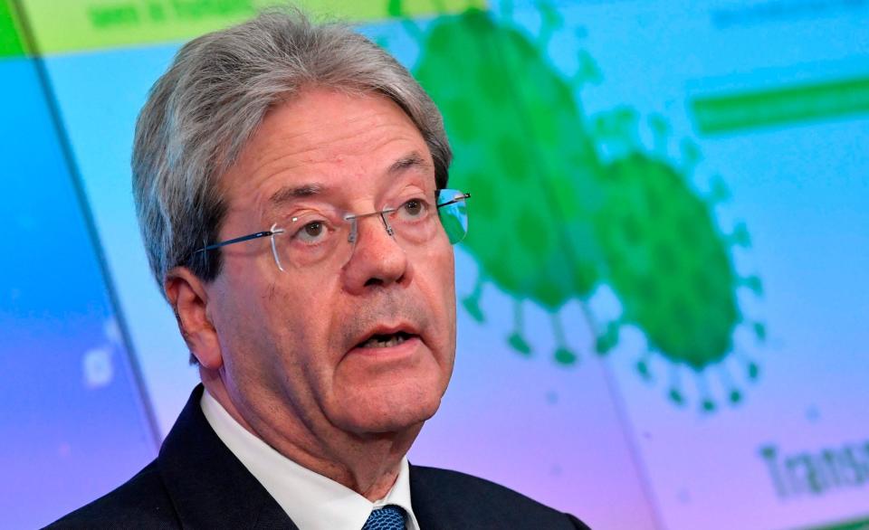 Paolo Gentiloni said a shift to WTO terms 'is expected to slow down the recovery' - John Thys/AFP