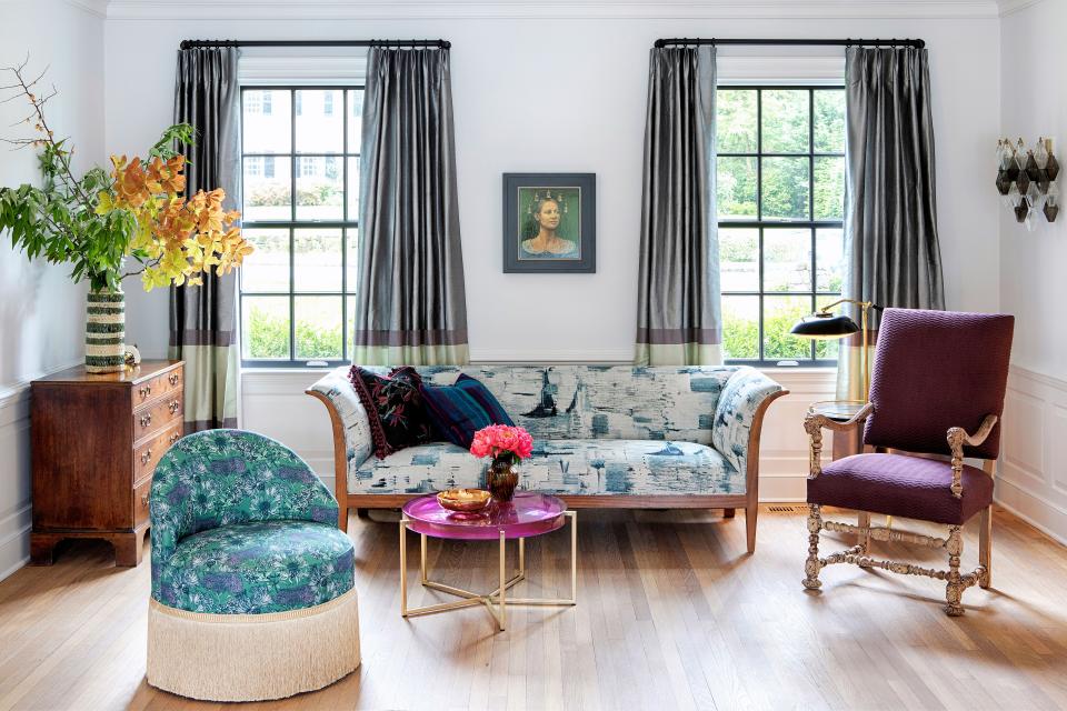 In this area of the living room sits a settee by Lief Almont that was upholstered in Eskayel fabric. Alan Macdonald’s portrait Bella was purchased from Stone Sparrow NYC, and the amethyst side table is by Holly Hunt.