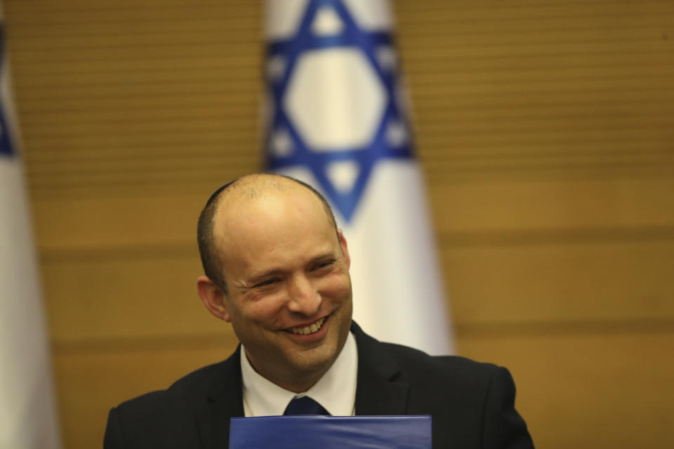 Israel's new prime minister Naftali Bennett holds a first cabinet meeting in Jerusalem Sunday, June 13, 2021. Israel's parliament has voted in favor of a new coalition government, formally ending Prime Minister Benjamin Netanyahu's historic 12-year rule. Naftali Bennett, a former ally of Netanyahu became the new prime minister (AP Photo/Ariel Schalit)