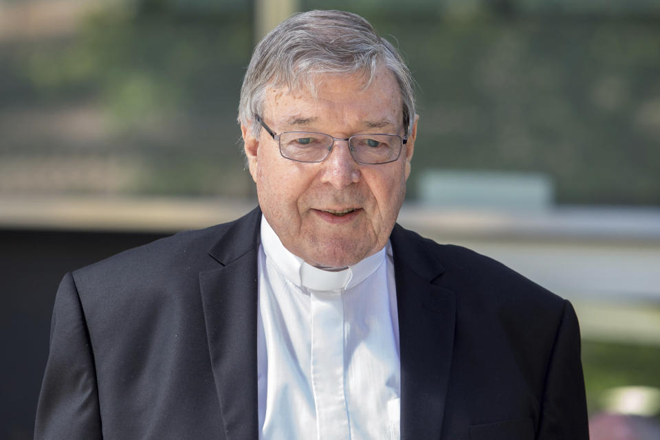 In this Dec 10, 2018, photo, Cardinal George Pell, the most senior Catholic cleric to face sex charges, departs an Australian court. Pell was sentenced in an Australian court on Wednesday, March 13, 2019 to 6 years in prison for molesting two choirboys in a Melbourne cathedral more than 20 years ago. (AP Photo/Asanka Brendon Ratnayake)