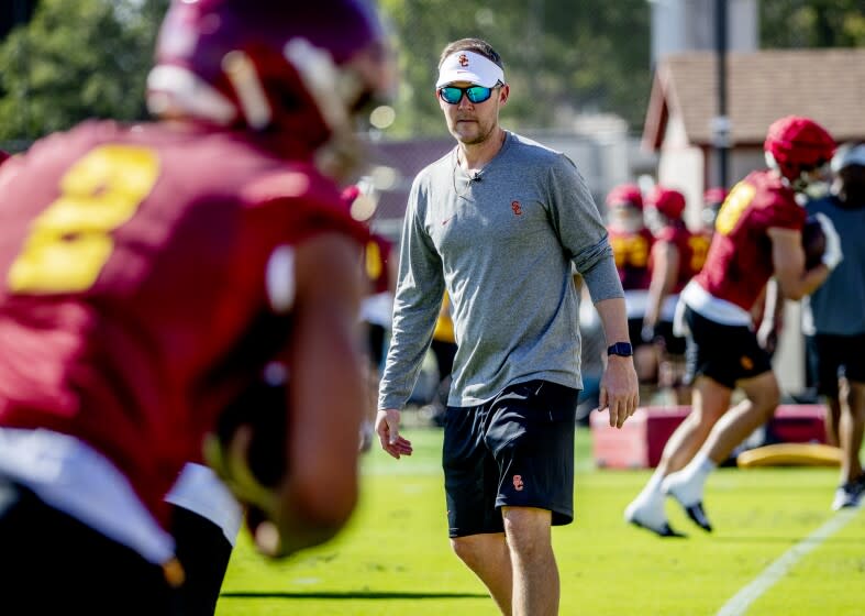 LOS ANGELES, CA - MARCH 22, 2022: First year USC football coach Lincoln Riley watches.