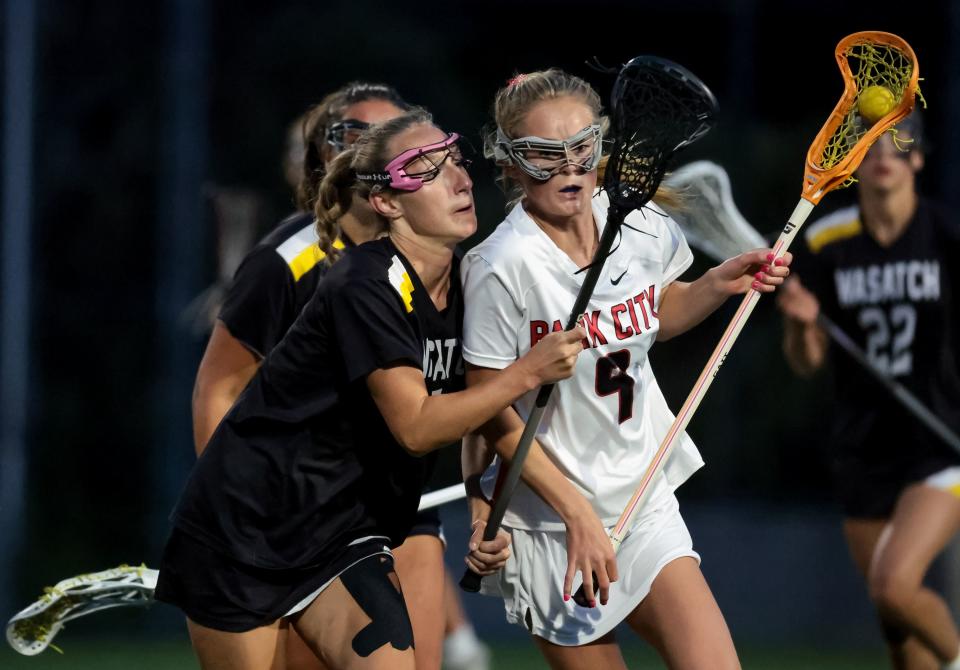 Park City’s Coco Crawford moves against Wasatch’s Eliza Smedley in a 5A girls lacrosse semifinal game at Westminster College in Salt Lake City on Tuesday, May 23, 2023. | Spenser Heaps, Deseret News