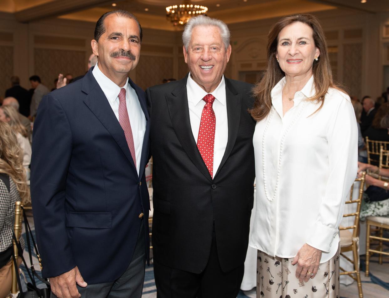 Paul Leone, John C. Maxwell and Kathy Leone at the YMCA of the Palm Beaches Prayer Breakfast in 2023. This year's breakfast is set for Dec. 10 at The Breakers.