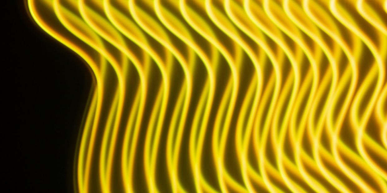 interlaced yellow and orange lines on a black background