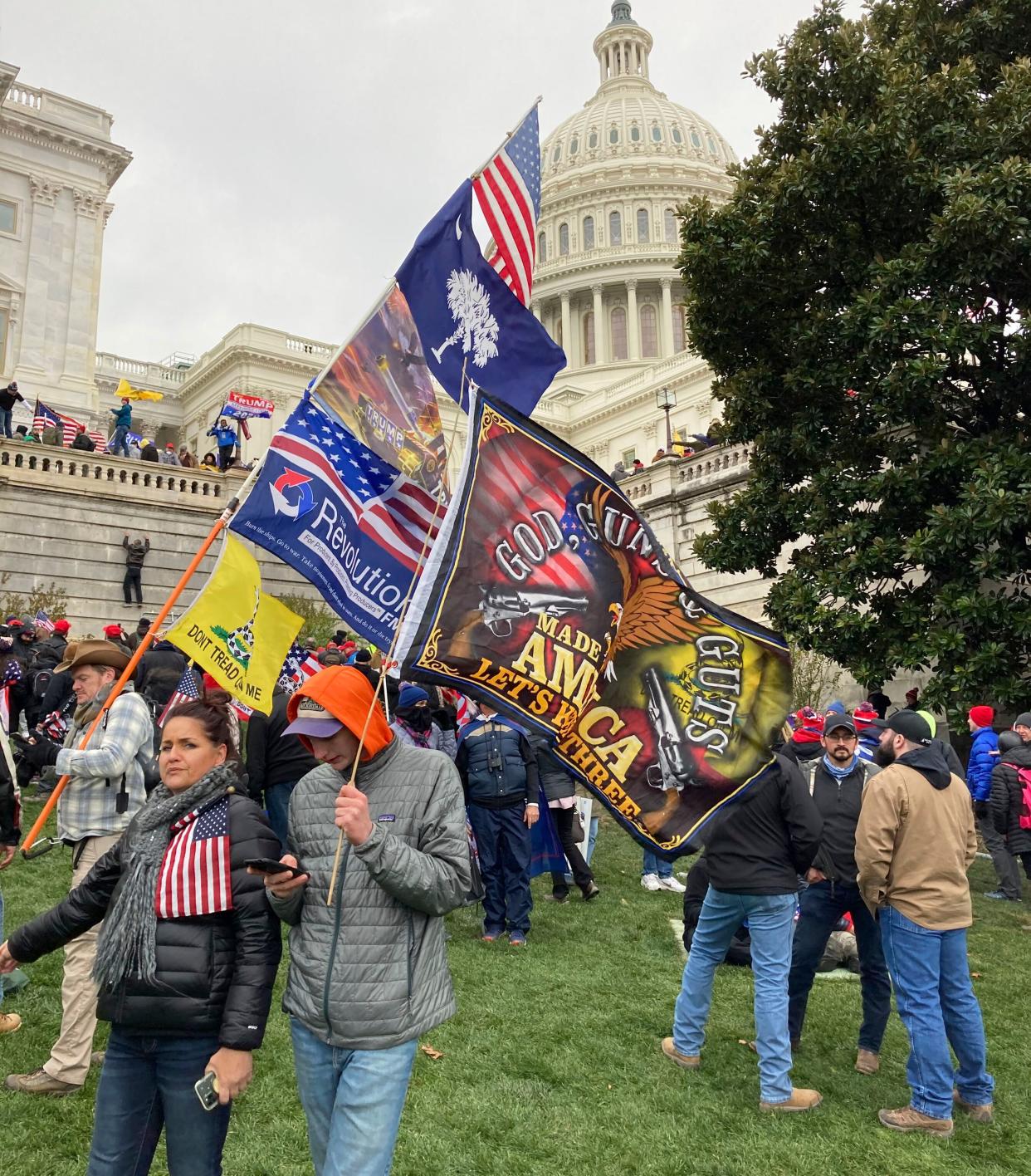 People hold flags glorifying violence and religion near the U.S. Capitol, which was breached on Jan. 6 by thousands of rioters who rejected the results of the 2020 presidential election. (Photo: zz/STRF/STAR MAX/IPx)