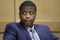 Dayonte Resiles, 27, is shown in court during opening arguments in his murder trial at the Broward County Courthouse on Wednesday, Nov. 17, 2021, in Fort Lauderdale, Fla. Resiles is accused in the stabbing death of Jill Halliburton Su in her Davie home in 2014. After his initial arrest, Resiles escaped custody and led investigators on a 6-day manhunt. (Amy Beth Bennett/South Florida Sun-Sentinel via AP)