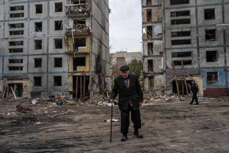 An elderly man walks by an apartment block destroyed by a Russian missile in Zaporizhzhia (Getty Images)