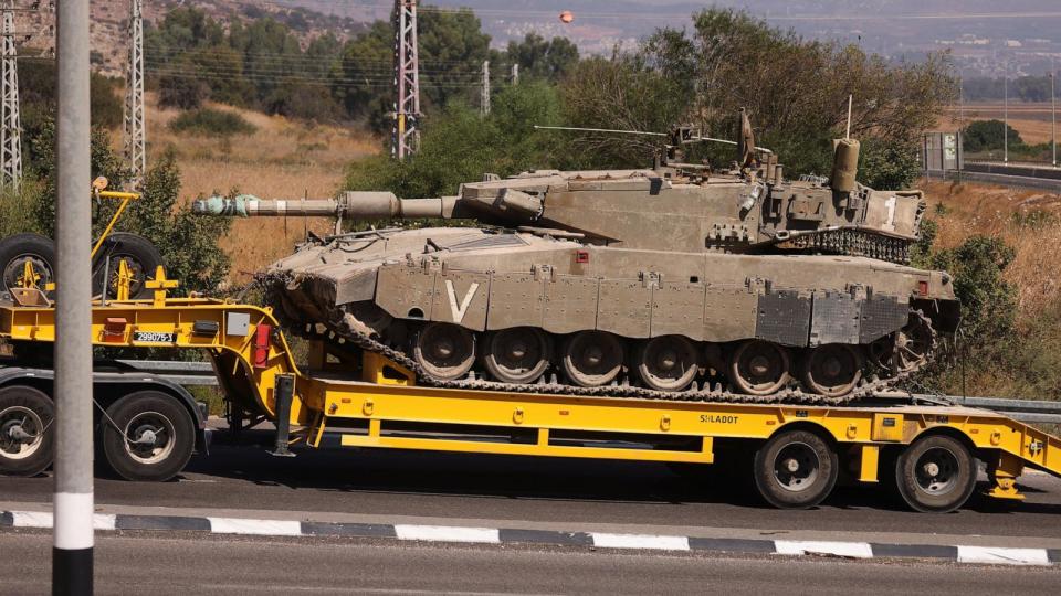 PHOTO: Israeli Army tanks are transported, amid cross-border hostilities between Hezbollah and Israel, in northern Israel, Sept. 26, 2024. (Jim Urquhart/Reuters)