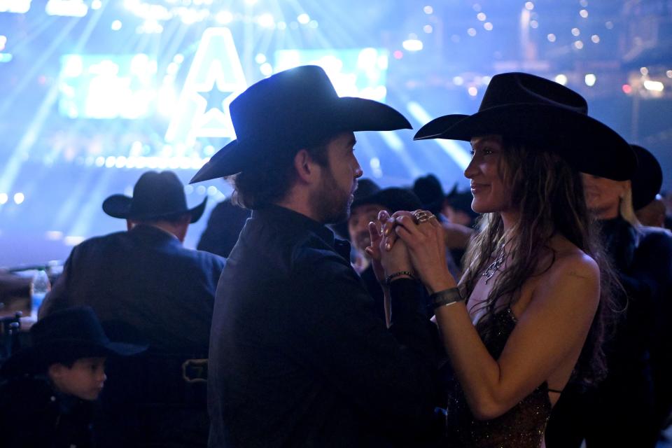 Adan Banuelos and Bella Hadid stare into each other's eyes at the American Performance Horseman.