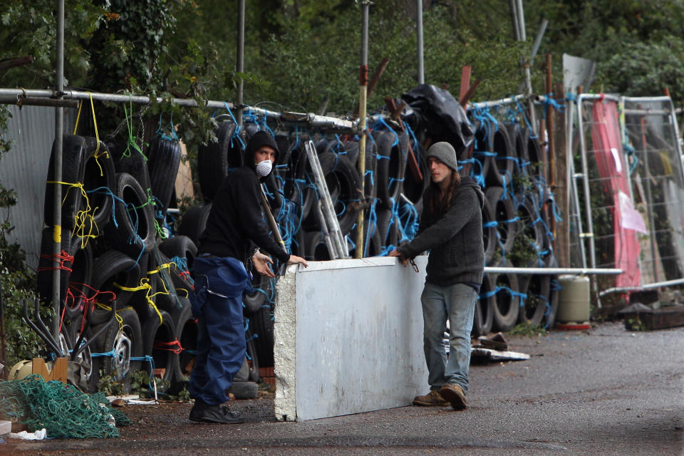 BASILDON, ENGLAND - SEPTEMBER 18: Activists barricade the Dale Farm travellers settlement on the night before the camp's eviction on September 18, 2011 in Basildon, England. Various court appeals to prevent the eviction of travellers from a portion of the camp without planning permission have failed.