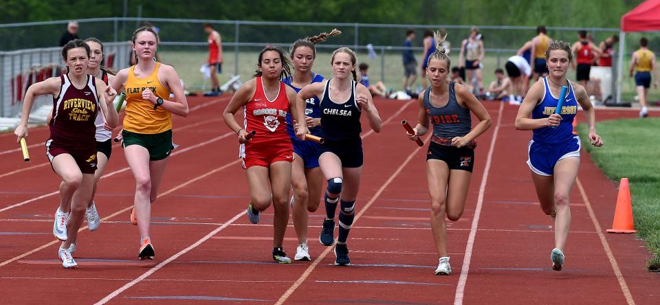 Veronica Fitzgerald (right) of Jefferson takes off to lead the 3,200-meter relay as Fitzgerald, Kim Miller, Alyssa Masserant and Jenna Pilachowski won the race at the Division 2 Regional on Friday, May 20, 2022 at Milan.