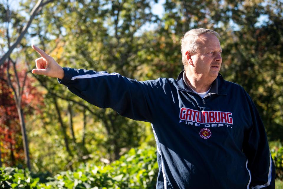 Gatlinburg Fire Chief Charlie Cole points to where a 2016 fire came down a mountain toward Gatlinburg.