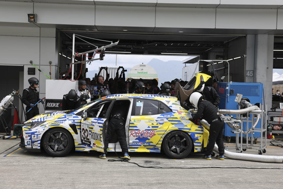 In this photo released by Toyota Motor Corp., Toyota’s Corolla racing car that runs on liquid hydrogen gets refueled during a 24-hour race at Fuji International Speedway in Oyama town, some 100 kilometers (62 miles) southwest of Tokyo, Saturday, May 27, 2023. The hydrogen-fueled Corolla has made its racing debut, part of a move to bring the futuristic technology into the racing world and to demonstrate Toyota’s resolve to develop green vehicles. (Toyota Motor Corp. via AP)