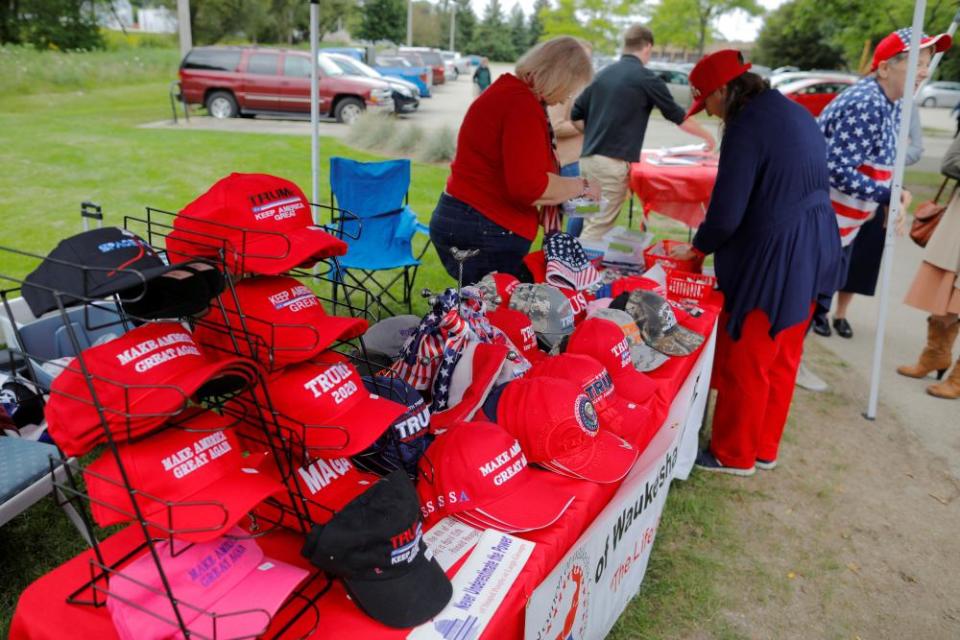 Hats supporting Donald Trump are displayed for sale at the Chicken Burn, a picnic gathering of Republicans and conservatives, in Milwaukee in September.