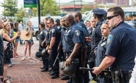 Police officers clear the street after protestors blocked traffic on the first day of pretrial motions for six police officers charged in connection with the death of Freddie Gray in Baltimore, Maryland in this September 2, 2015, file photo. REUTERS/Bryan Woolston/Files