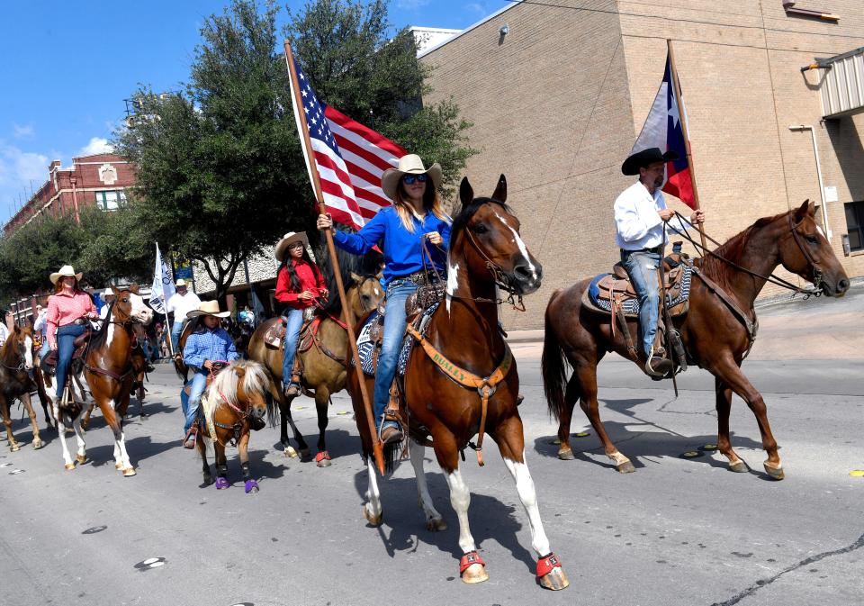 Equestrians ride down North First Street during Saturday's West Texas Fair & Rodeo Parade Sept. 10, 2022.