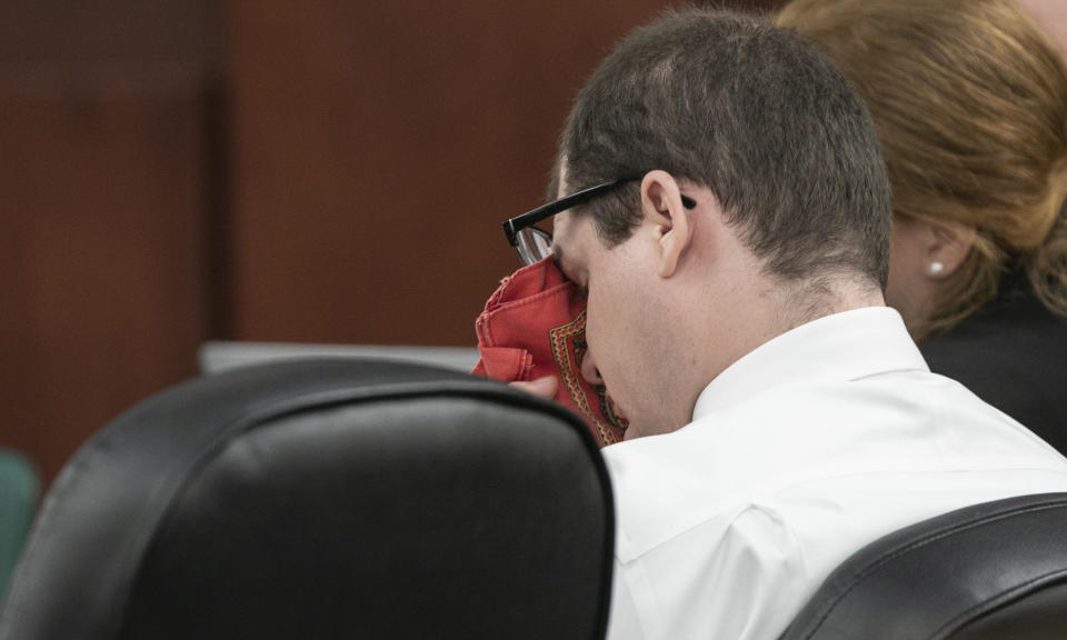 Timothy Jones Jr. wipes his eyes as his ex-wife Amber Kyzer, mother of five children who were killed by their father, Jones, during the sentencing phase of Jones' trial in Lexington, S.C., Tuesday, June 11, 2019. The mother of five children who were killed by their father stunned a South Carolina courtroom Tuesday by asking the jury to spare her ex-husband's life. (Tracy Glantz/The State via AP, Pool)