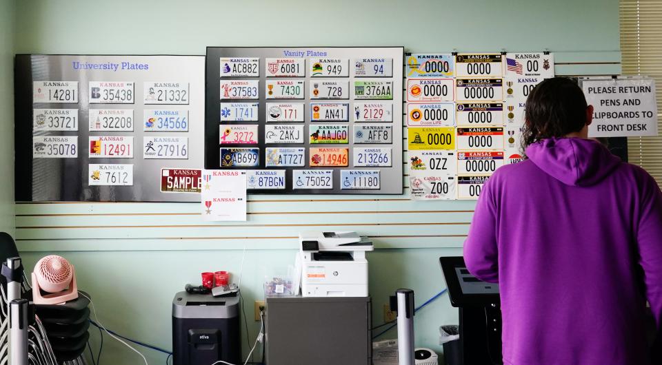 Customers walking in to the Shawnee County Motor Vehicle Annex, 5938 S.W. 17th St., Friday are greeted with a display of the over 40 distinct license plate styles for the state. A bill sent to Gov. Laura Kelly's desk this week may add three more, including one of Topeka's flag.