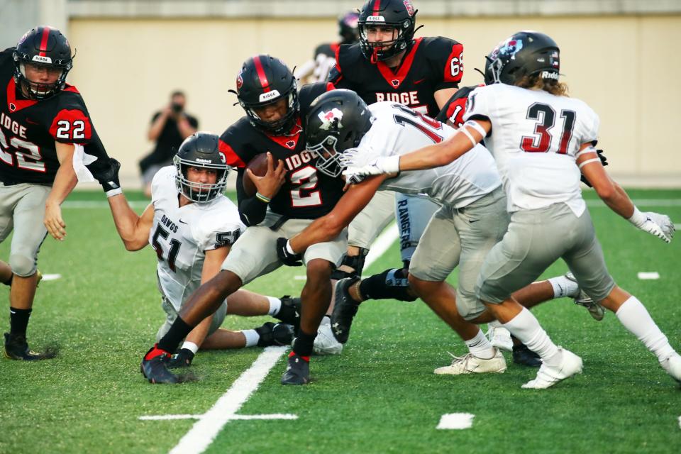 Bowie's Aaron Gall tackles Vista Ridge quarterback Desmonde Thomas II in 2021. Gall contributed 60 tackles and 10½ sacks for a team that went to the third round of the playoffs last season.