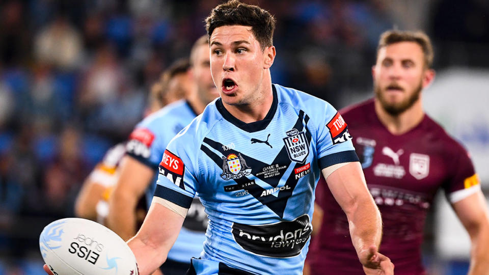 Seen here, Mitch Moses shows the ball for NSW in Game III against the Maroons. 